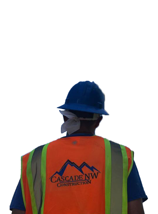 A man wearing an orange vest with cascade nw construction on it