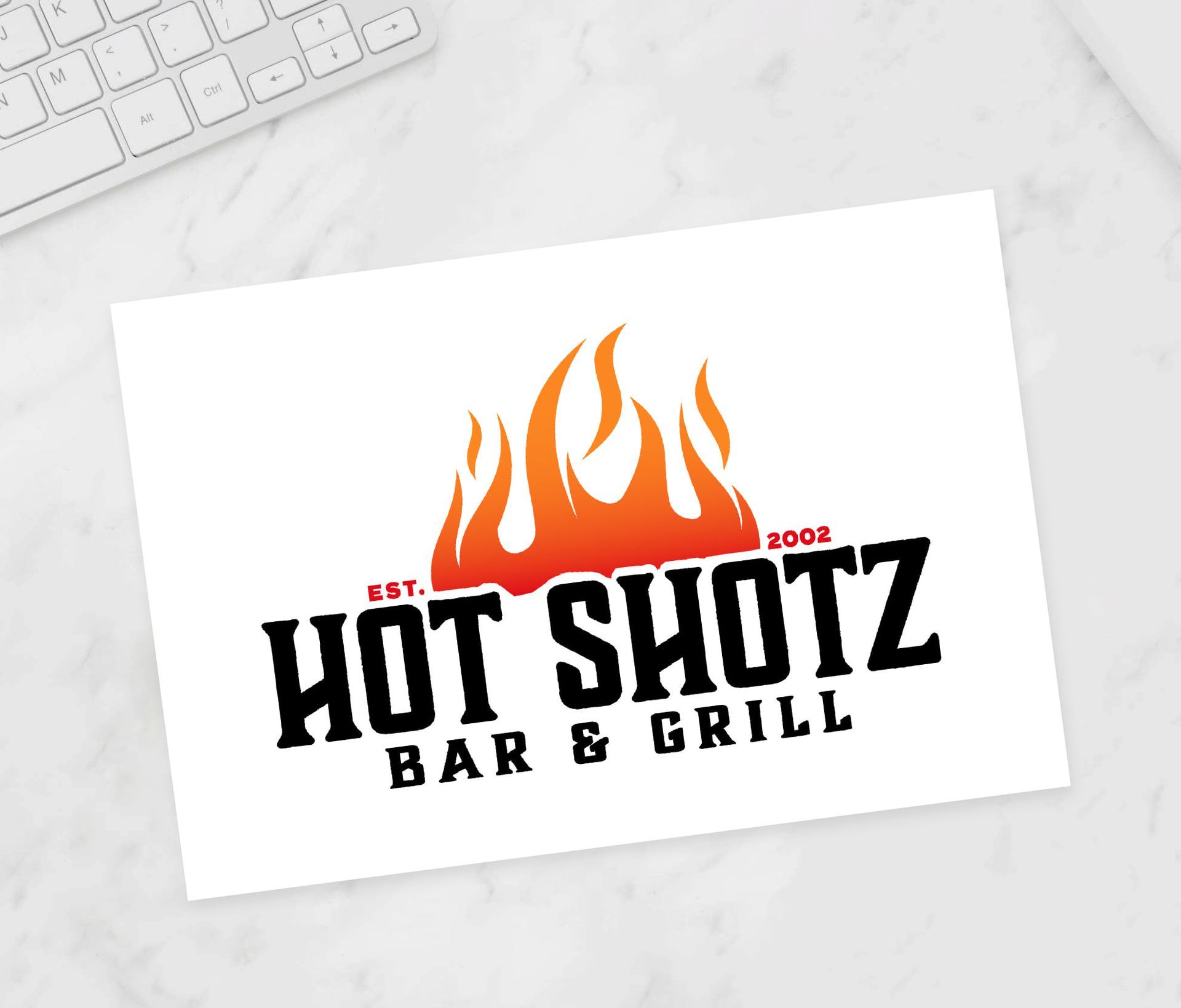 A business card for hot shotz bar and grill
