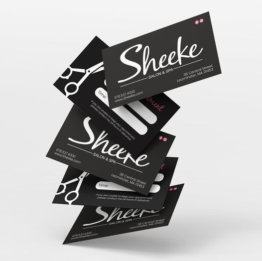 A stack of business cards for sheeke salon & spa