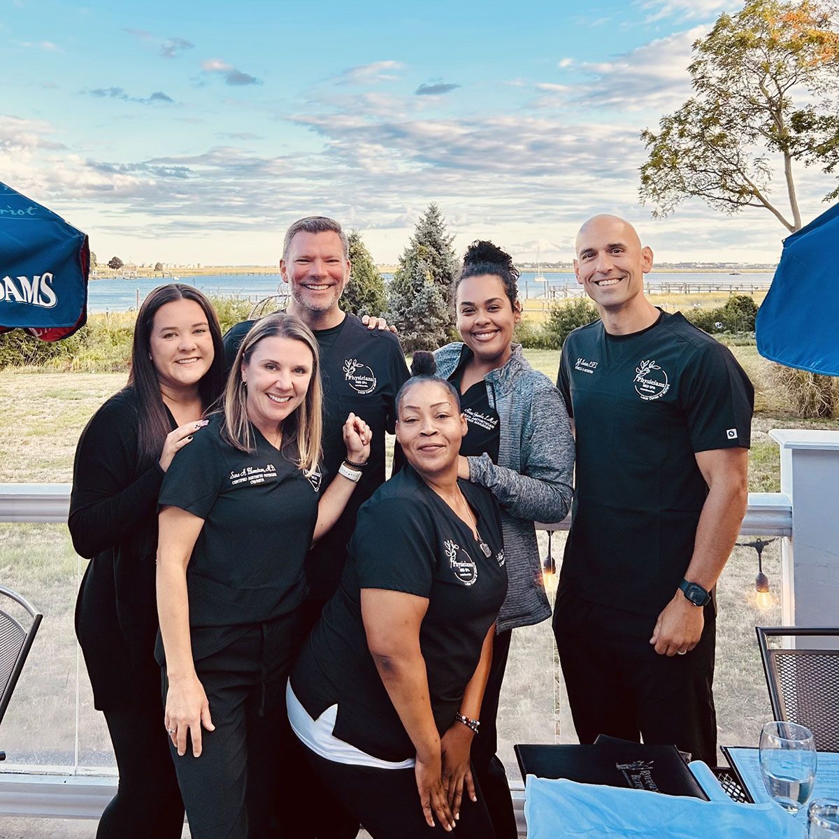 people are posing in front of door