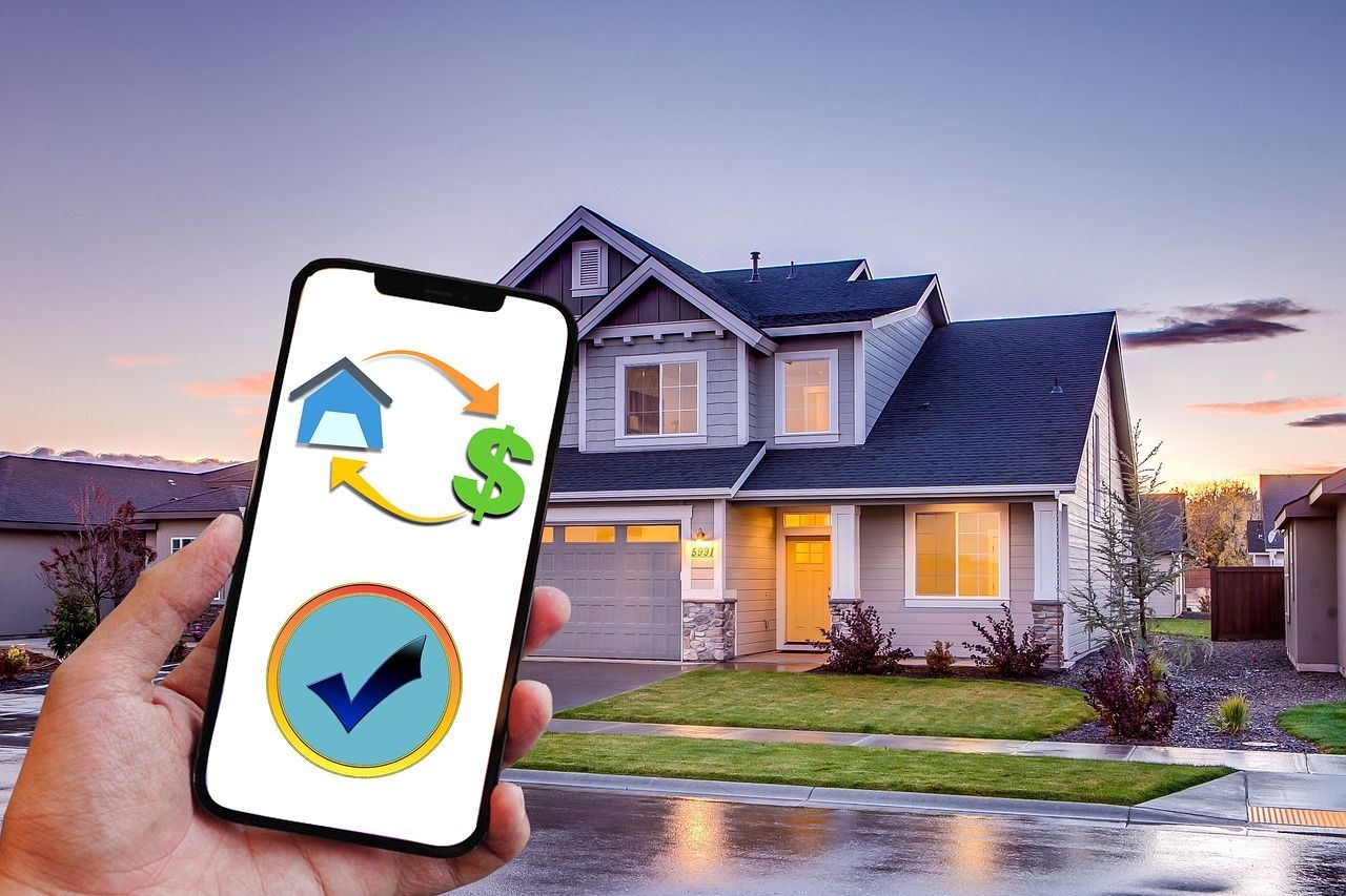 Hand holding a smartphone with refinancing icons in front of a modern house, mortgage refinance