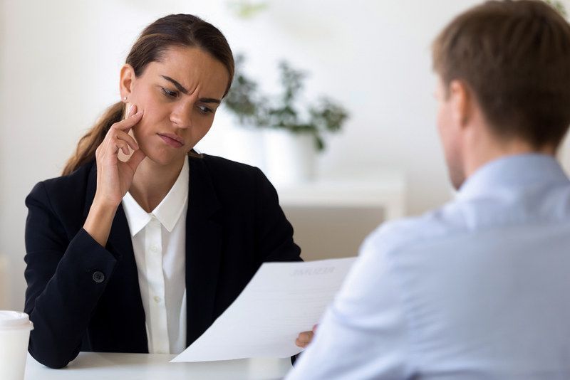 Person reviewing paperwork for a loan application.
