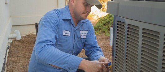 Man Fixing HVAC — Heating Service in Knoxville, TN