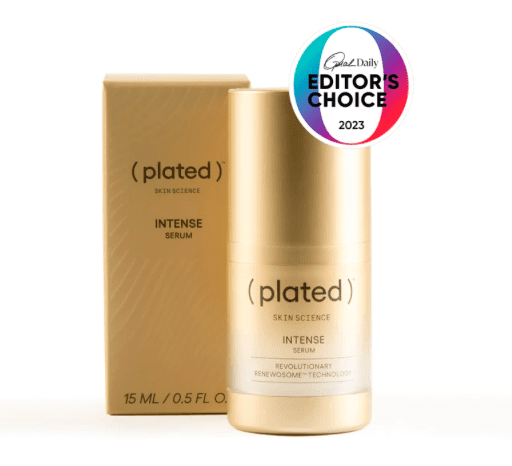 A bottle of ( plated ) intense serum next to its box