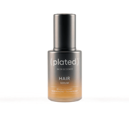 A bottle of plated hair serum on a white background.