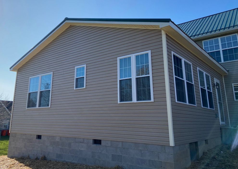 A house with a lot of windows on the side of it.