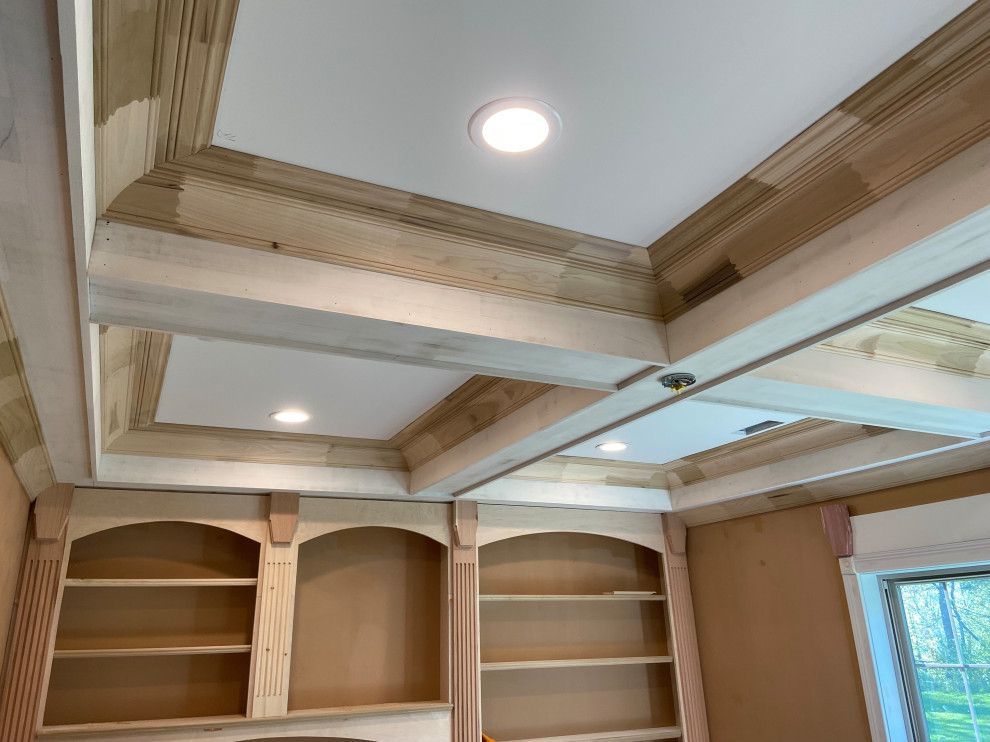 A room with wooden shelves and a white ceiling.