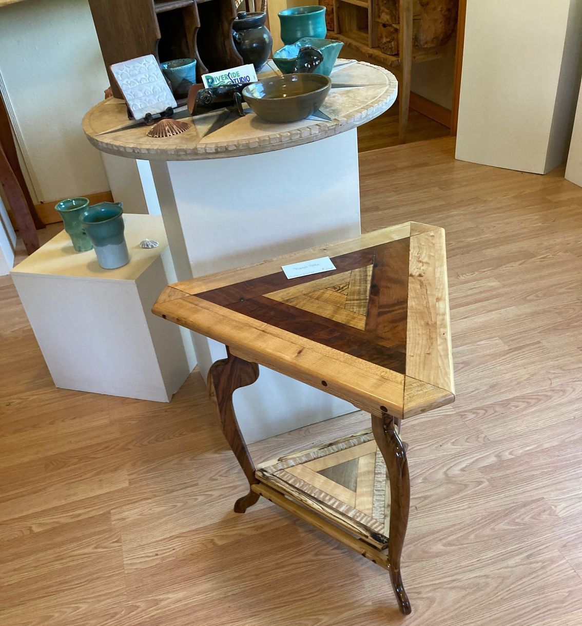 A bunch of wooden spoons are stacked on top of each other