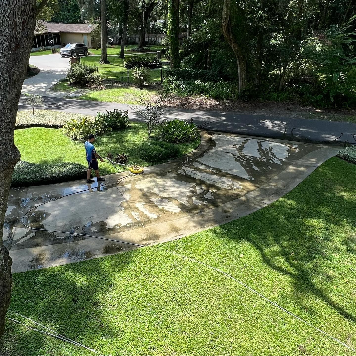 Man Cleaning Driveway | Jacksonville, FL | Coastal Pressure Washing