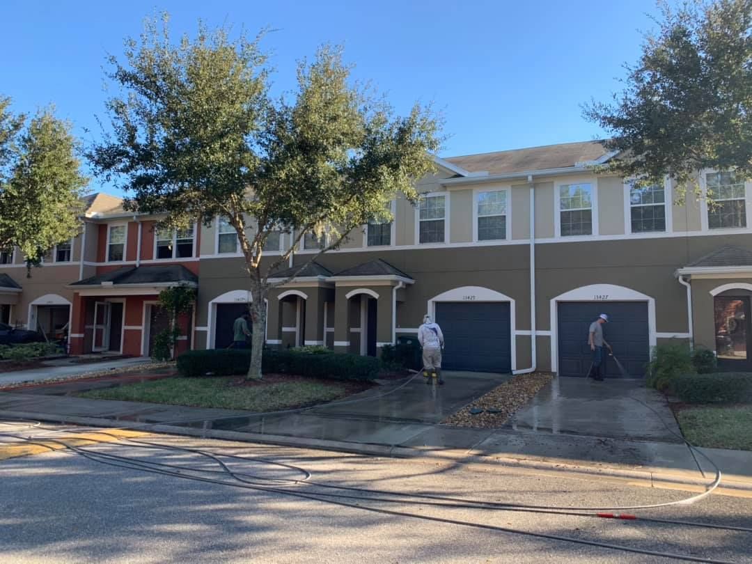 Man Cleaning Driveway of House | Jacksonville, FL | Coastal Pressure Washing