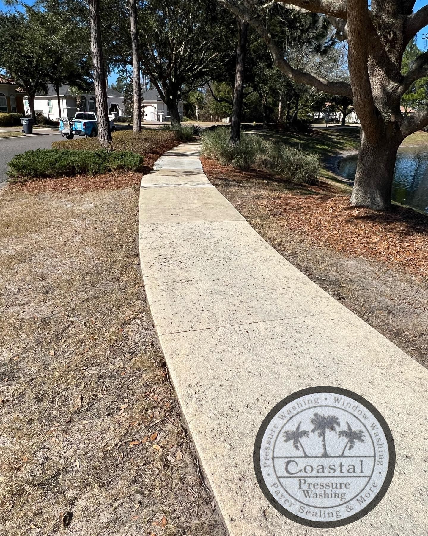 Concrete Walkway Leading to Pond | Jacksonville, FL | Coastal Pressure Washing
