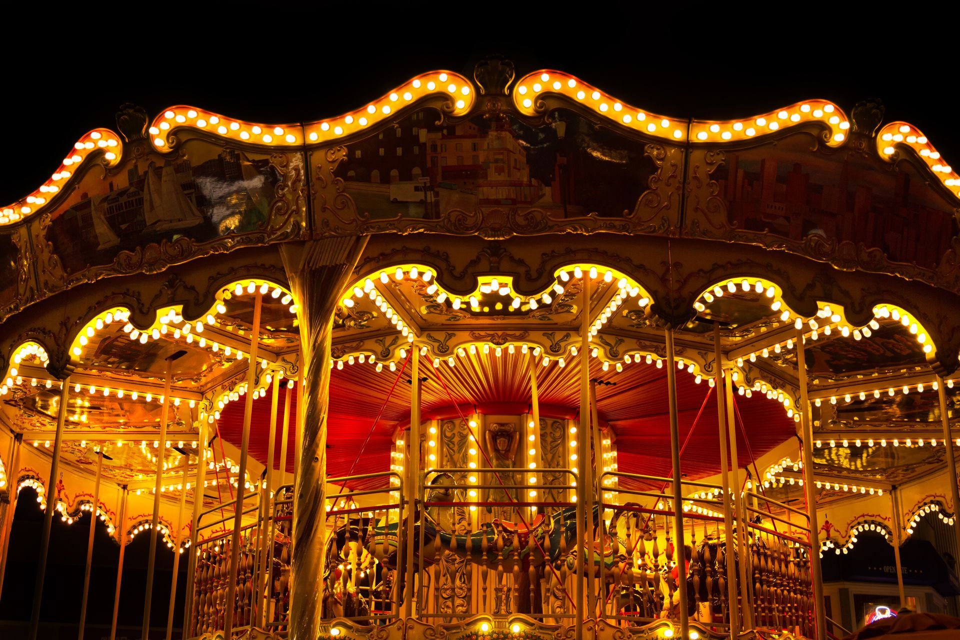 A merry go round that is lit up at night