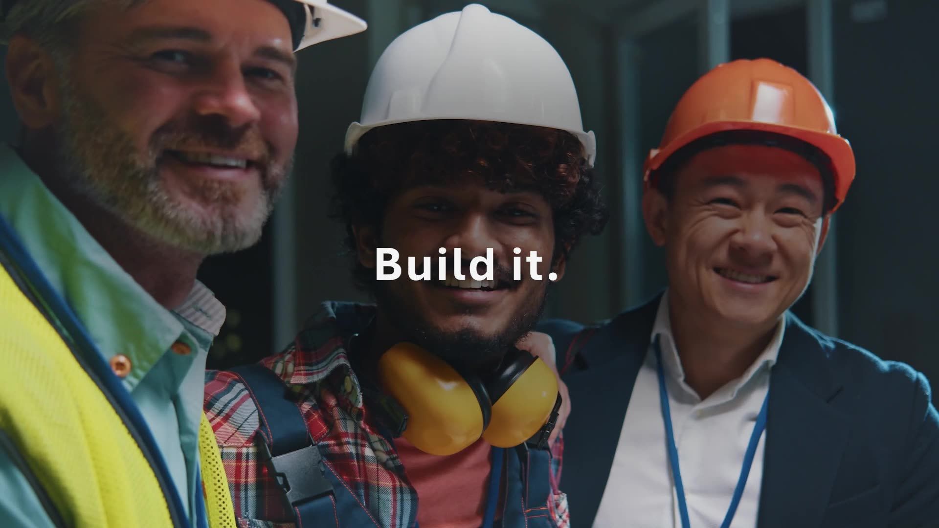 A man and a woman are looking at a computer screen