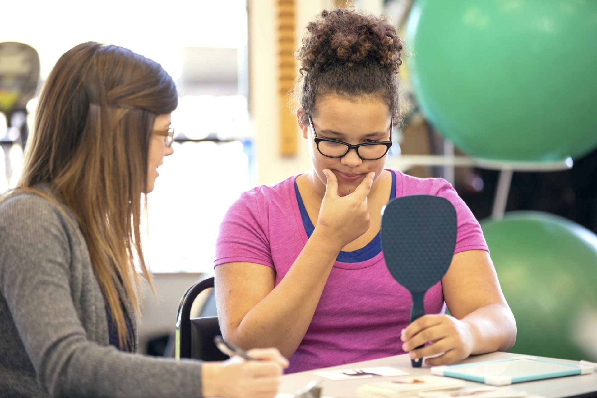 Woman Teaching a Adult Woman — Babylon, NY — South Shore Speech, Language & Swallowing Disorders, PLLC