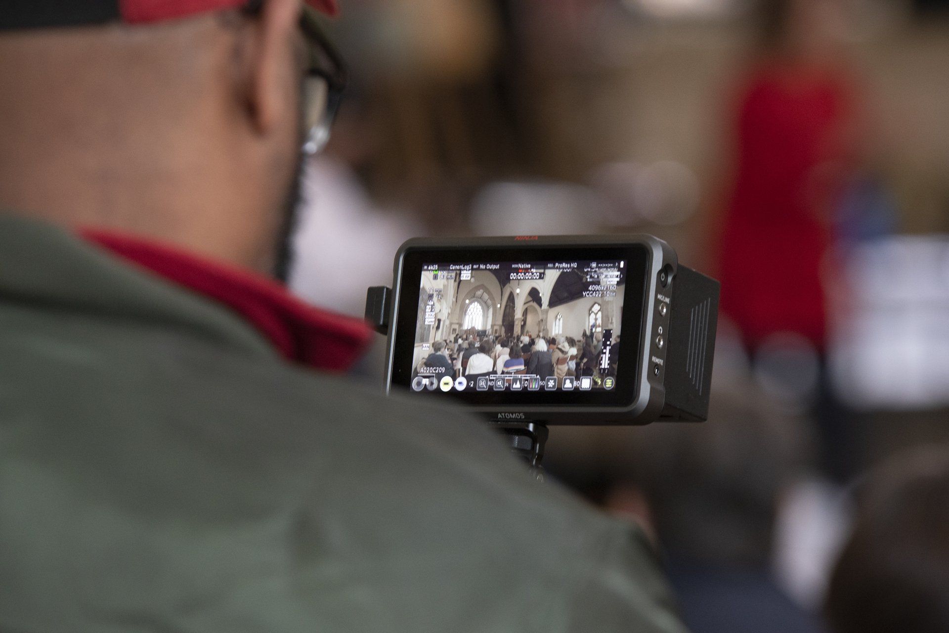 A man is taking a picture with a camera.