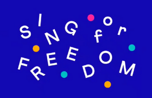 A blue background with white letters that say sing for freedom