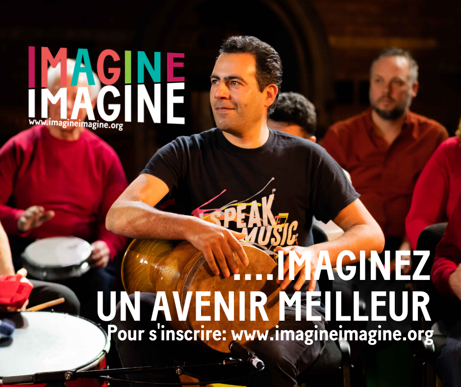 A man is playing a drum in front of a group of people with the words imagine imagine on the bottom