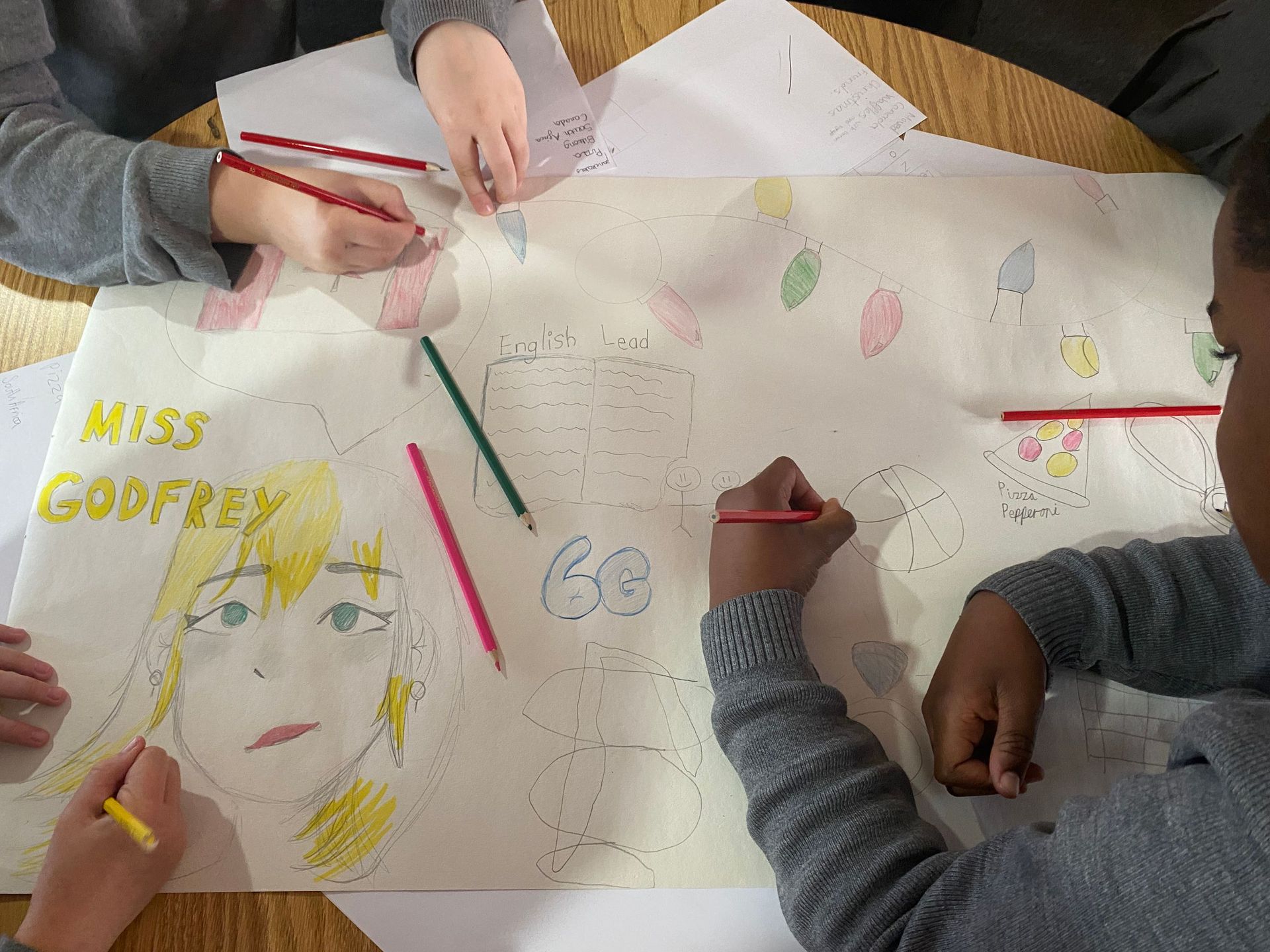 A group of children are drawing a picture of miss godfrey