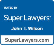 A blue sign that says `` super lawyers john t. wilson ''