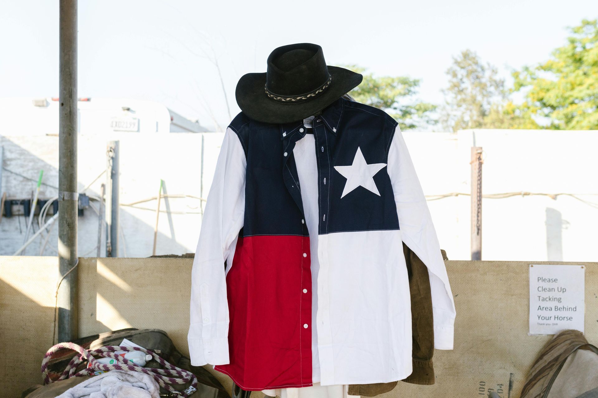 Shirt with Texas flag design and cowboy hat.