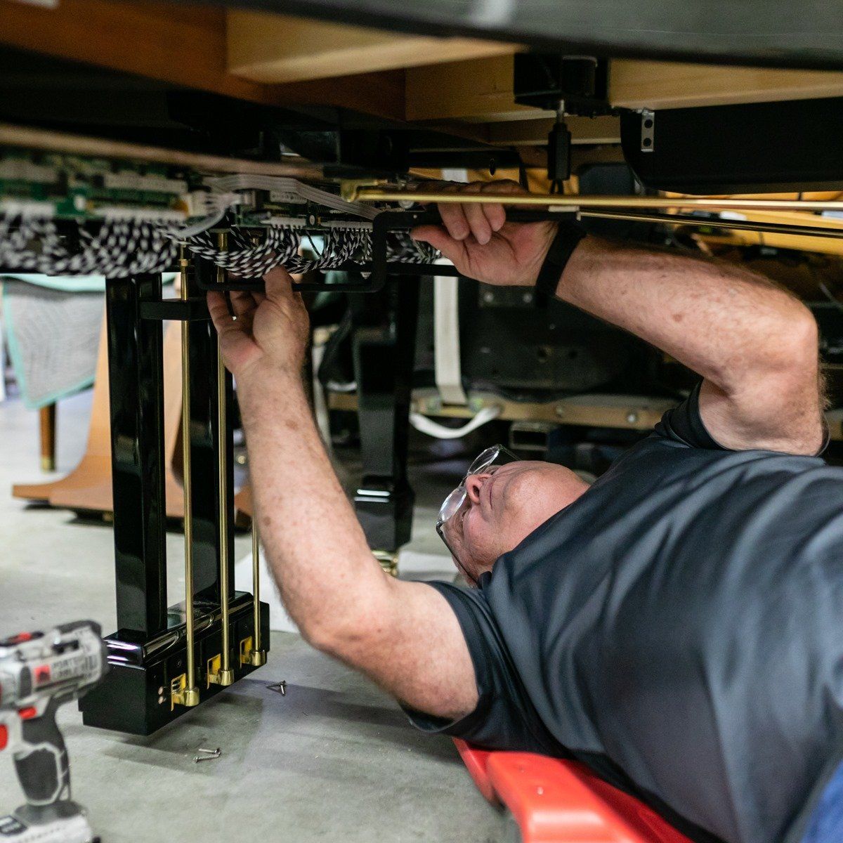 Man Fixing The Piano — Salt Lake City, UT — Barrus Pianos