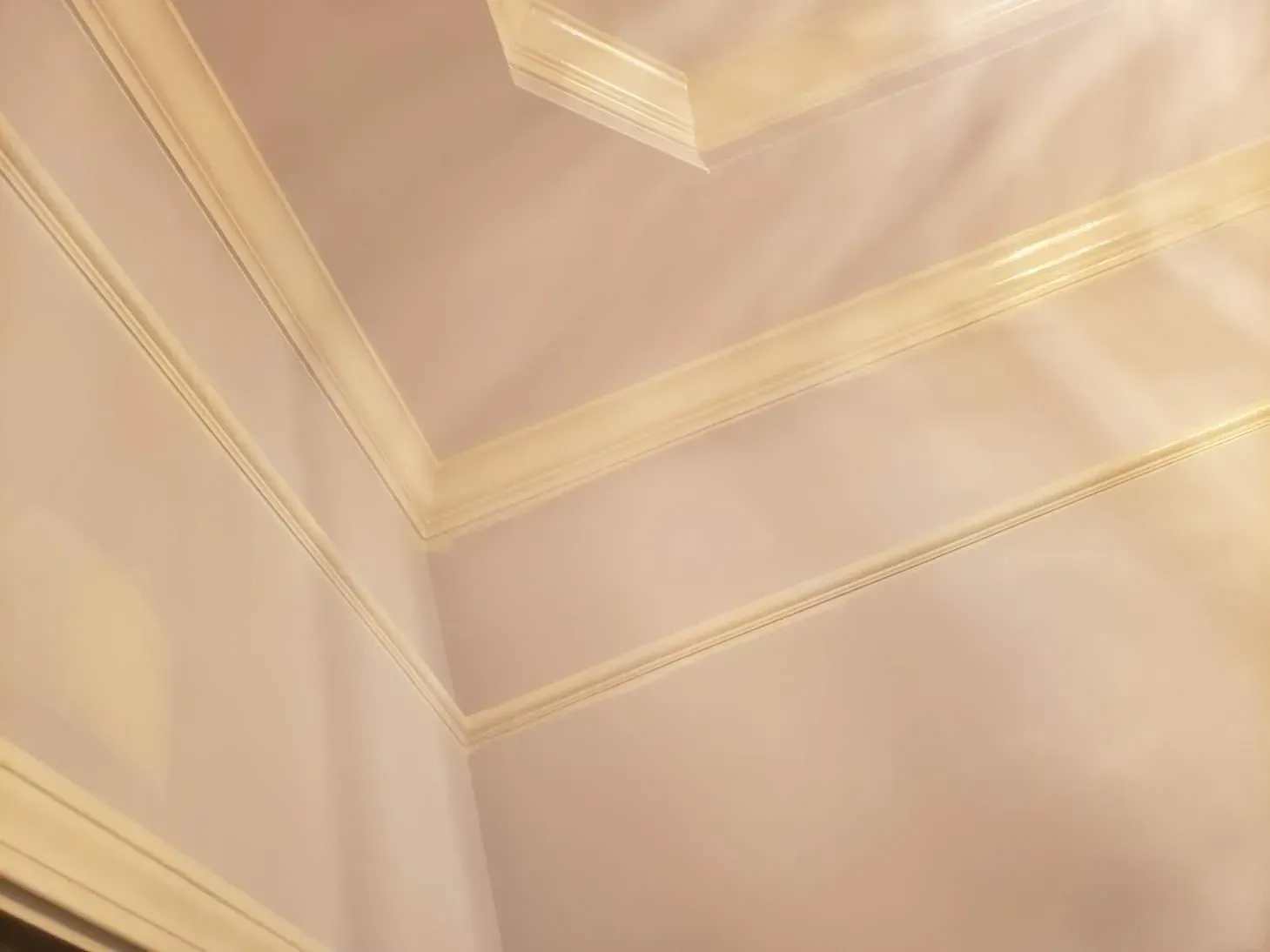 Pale lilac walls and white crown molding in a room corner.