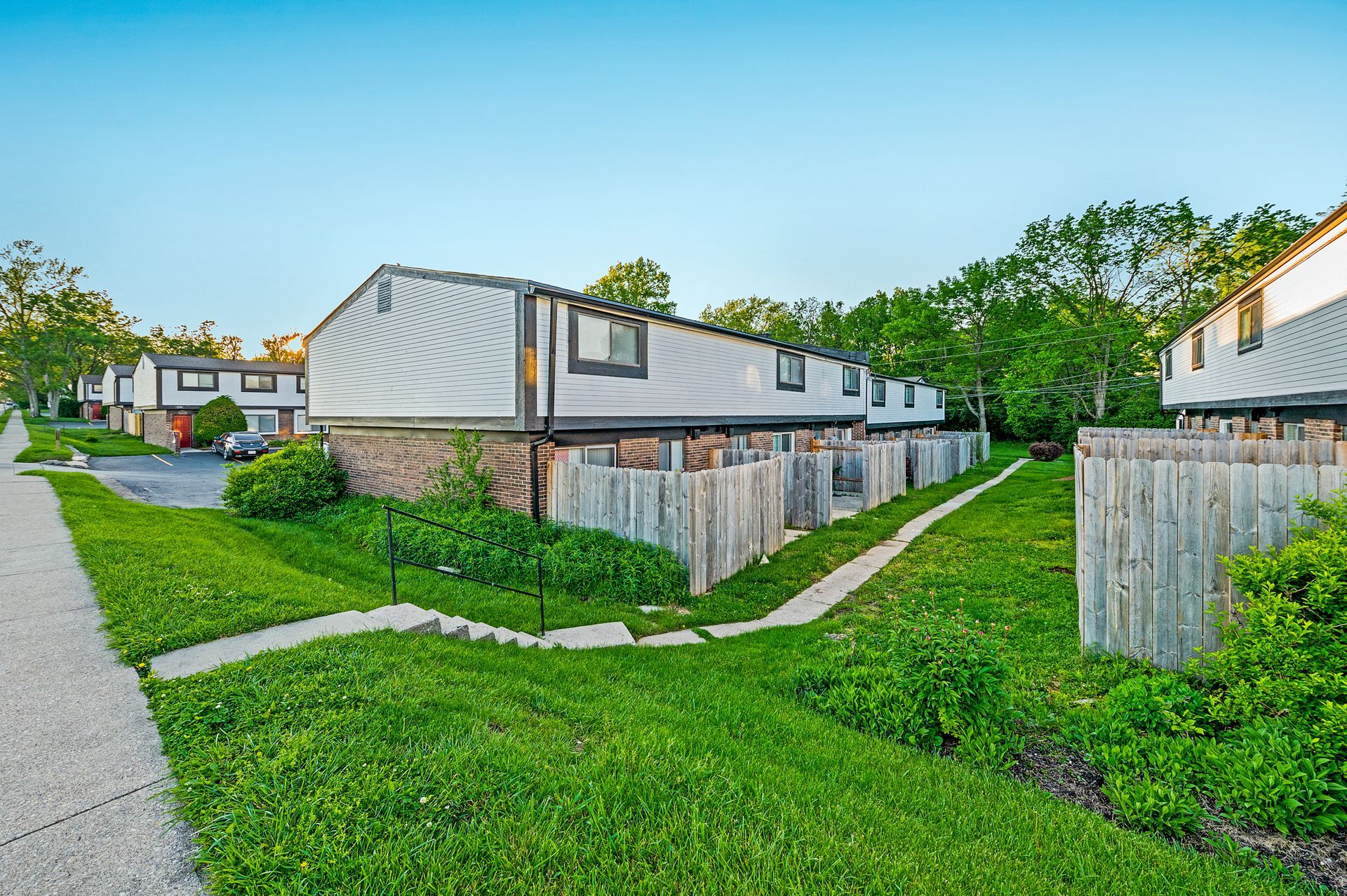 Photo of Village Square sidewalk leading to private patios