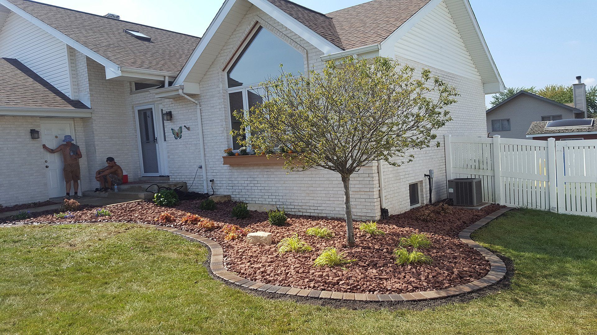 Mulching Tree Outside the House — Dyer, IN — Star Landscaping