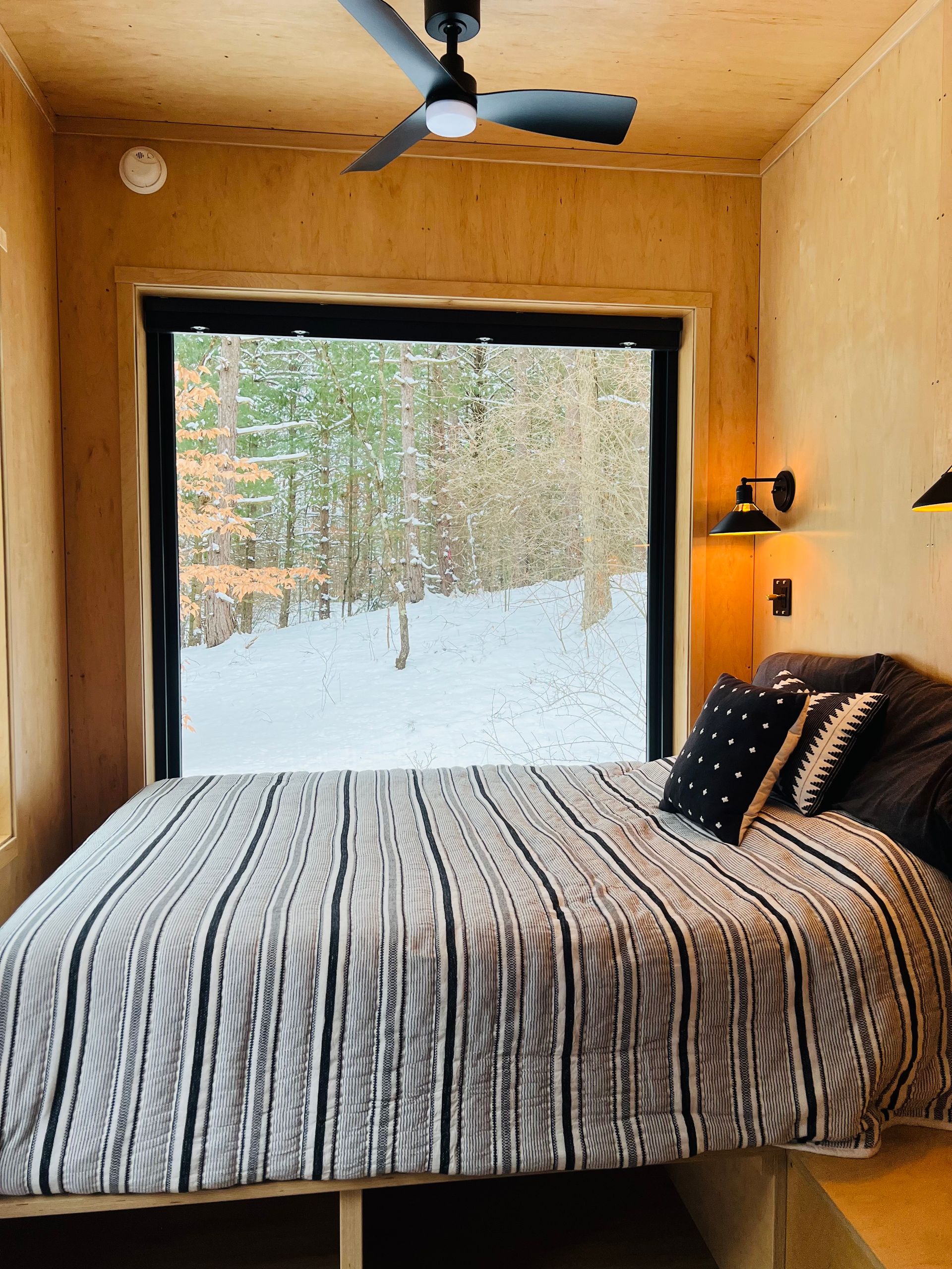 view of the bed at natures escape cabin