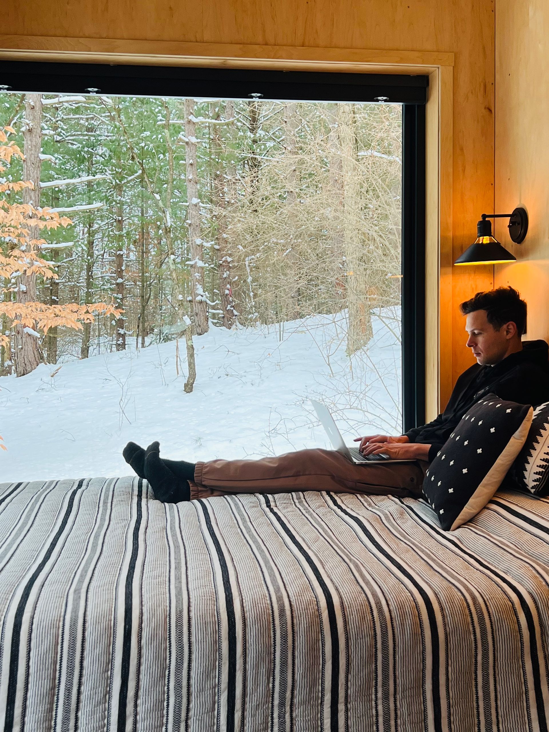 natures escape cabin relaxing on the bed