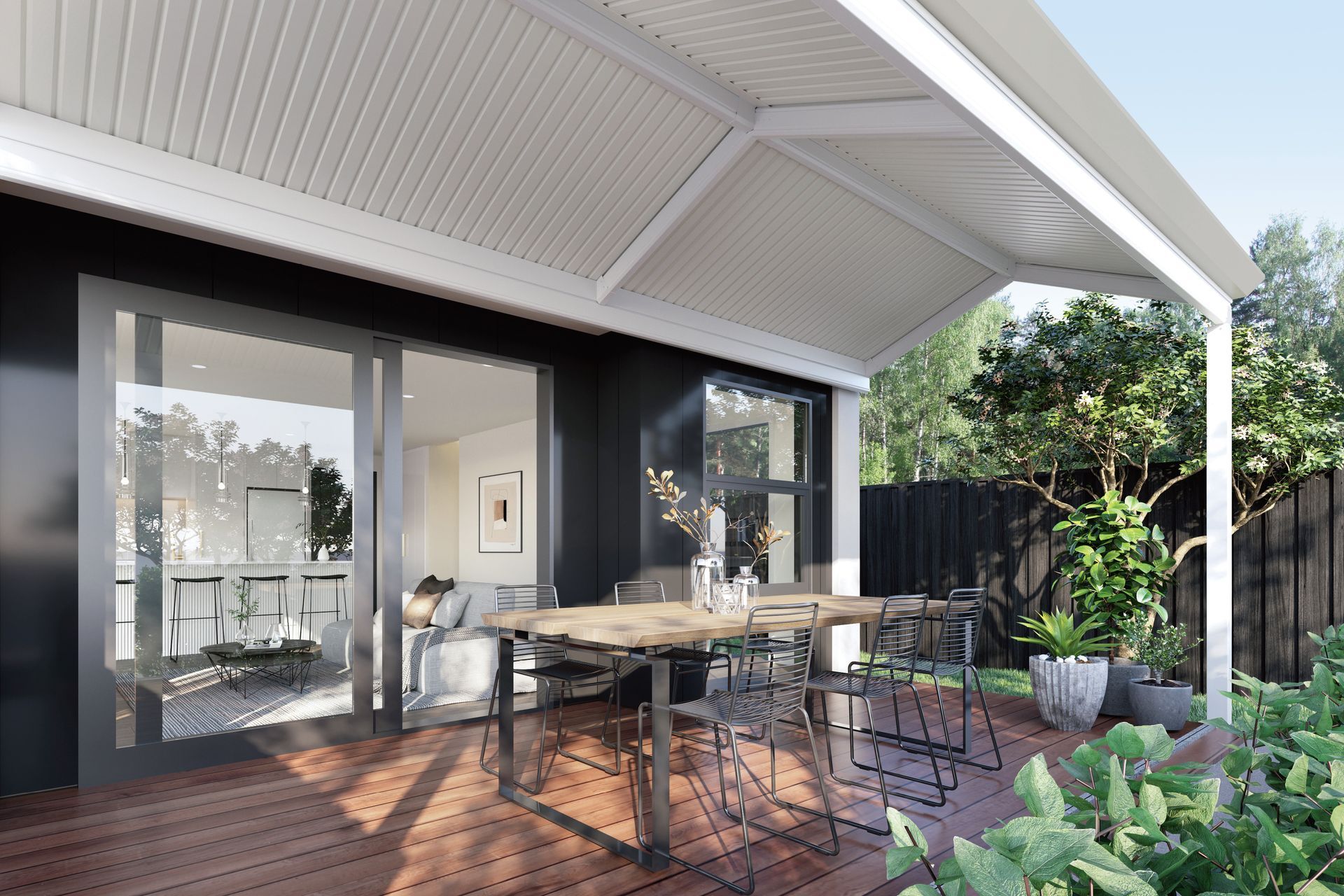 Outdoor patio with dining table and chairs, covered by a white pergola, leading to a dark house with glass doors — Precision Patios Toowoomba In Toowoomba, QLD