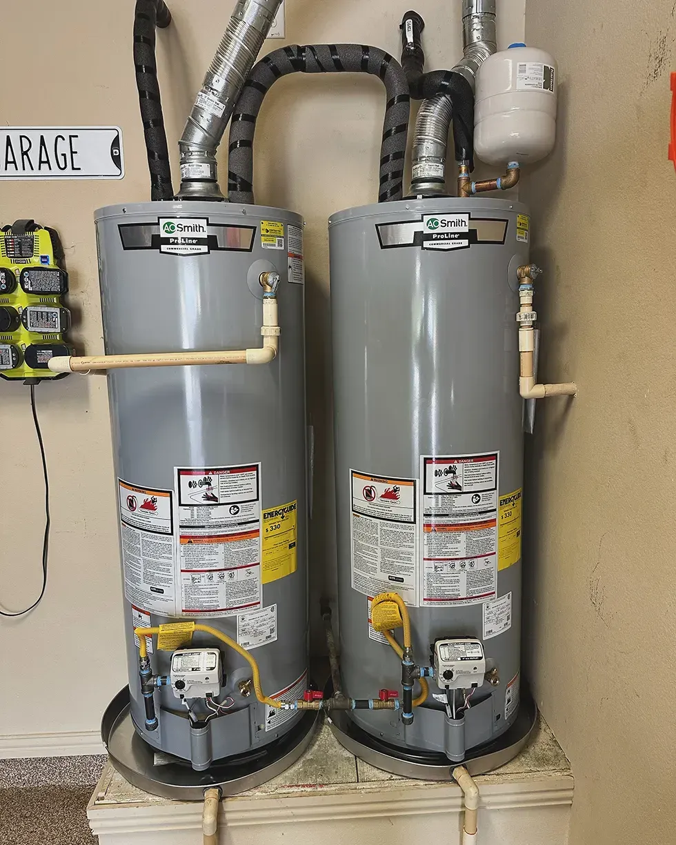 Two smith water heaters are sitting next to each other
