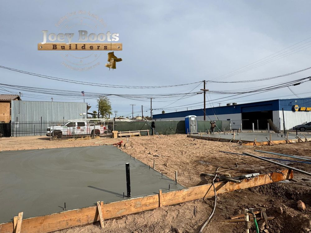 A construction site with a sign that says joe boots builders