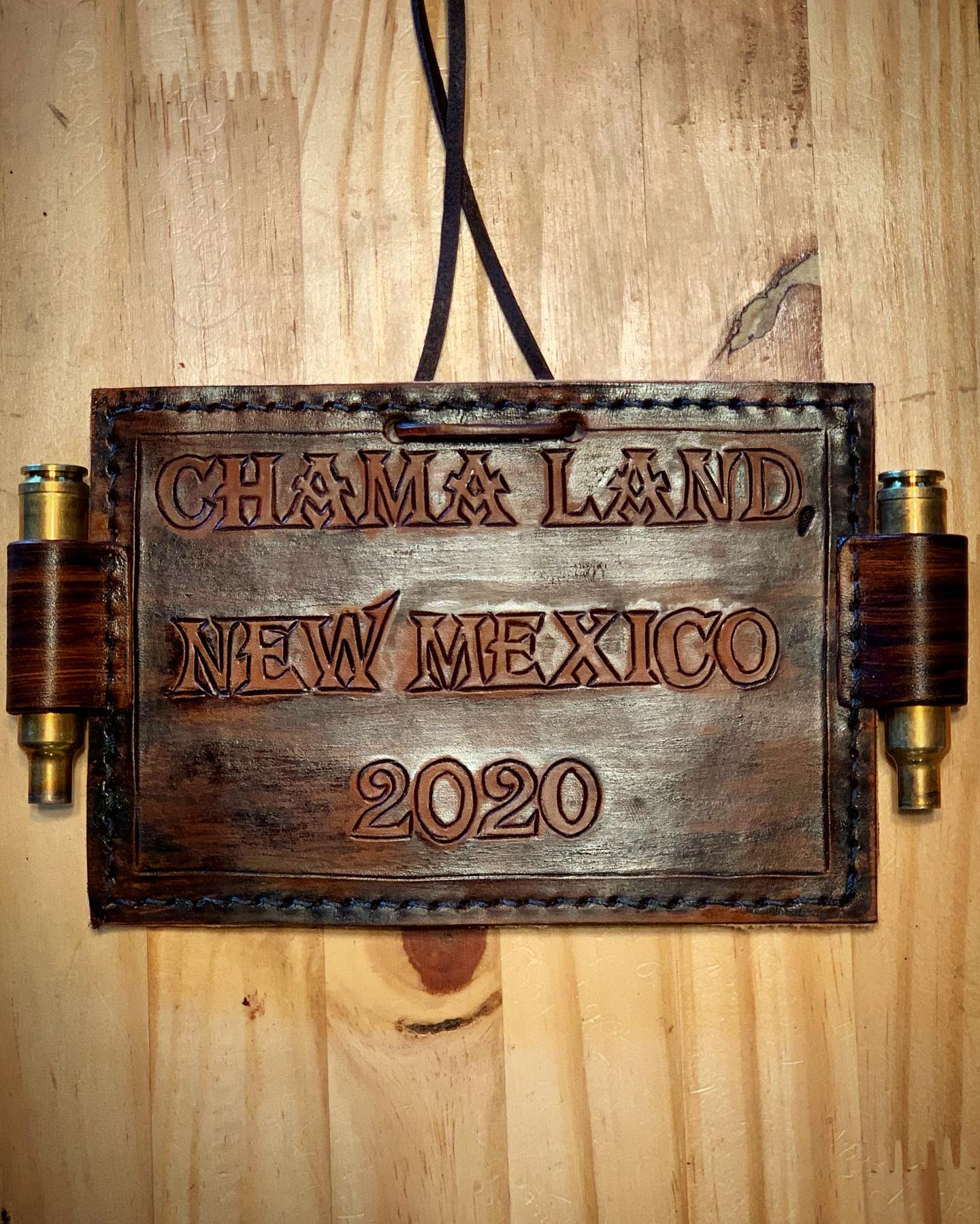 A wooden sign that says chama land new mexico 2020