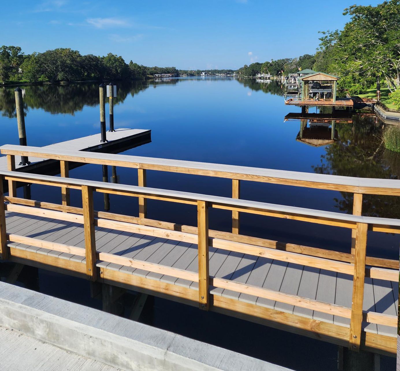 A wooden bridge over a body of water at Riverview Marina