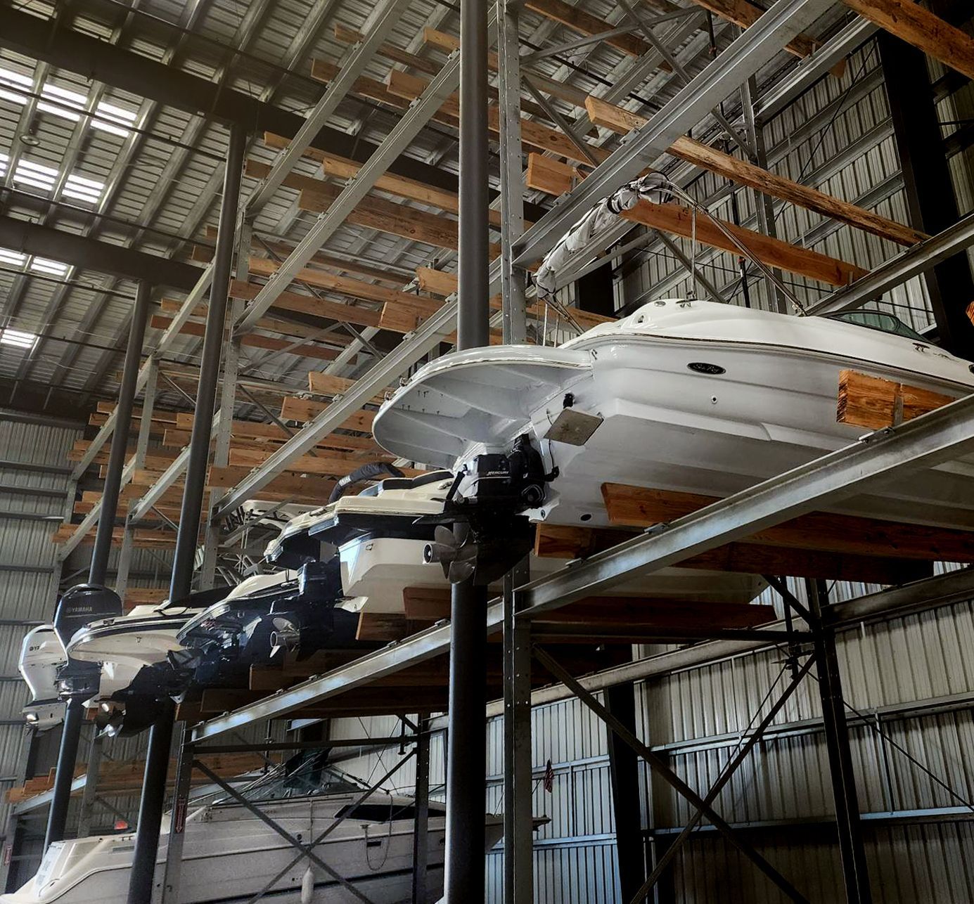 A boat is sitting on a shelf inside Riverview Marina boat storage building