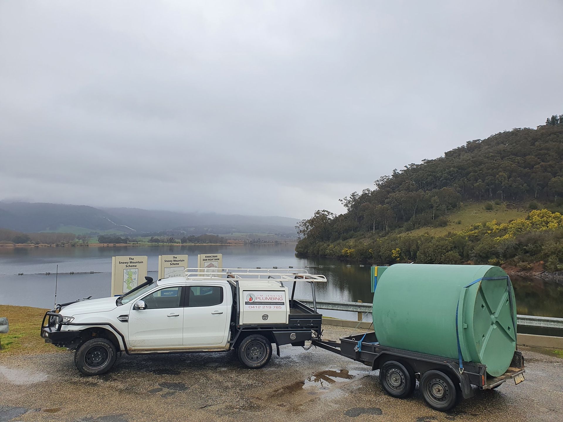 White Truck Pulling a Green Tank Trailer — Mi Plumber Wagga Wagga in Lake Albert, NSW