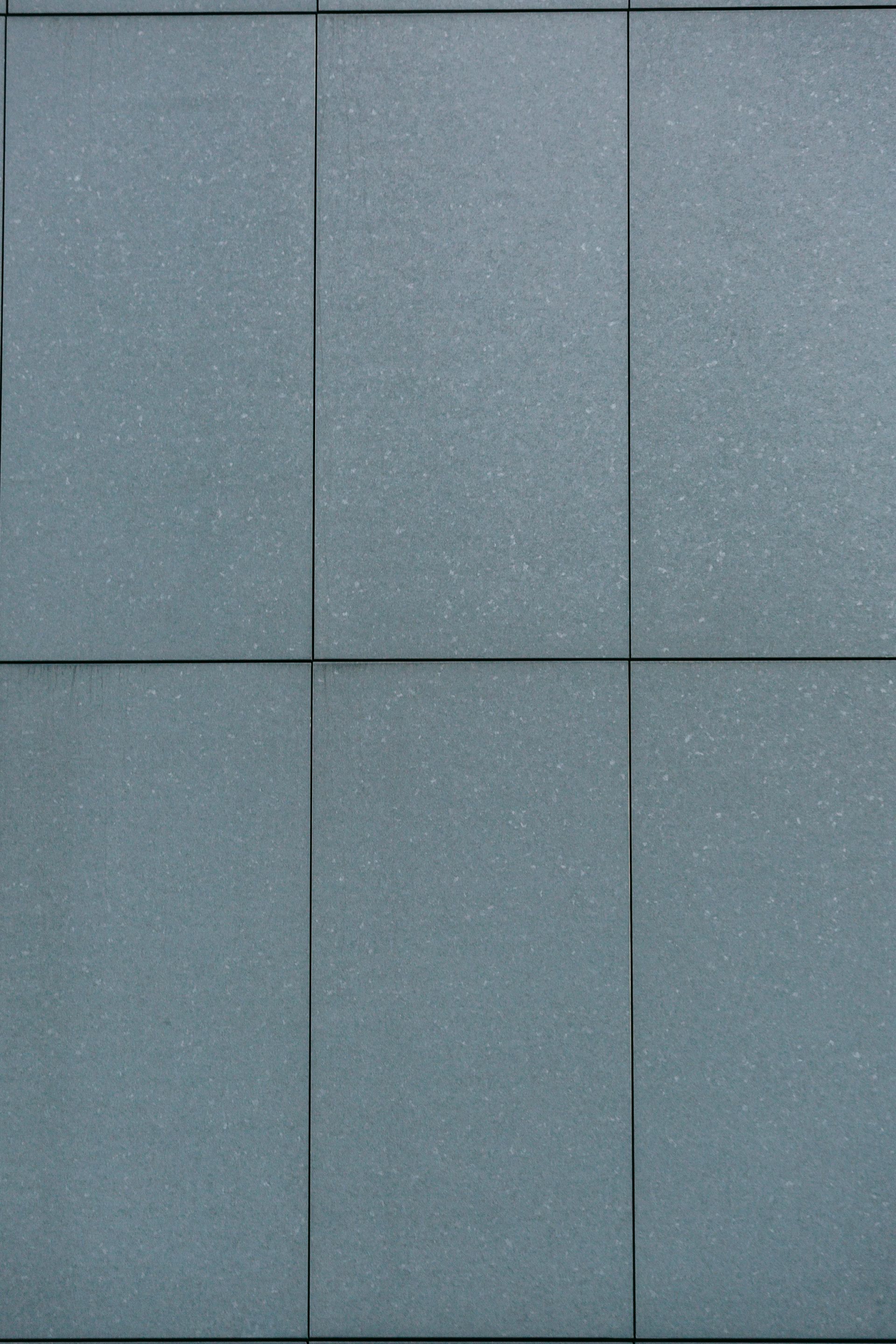 Six gray rectangular panels with visible seams; close-up view.