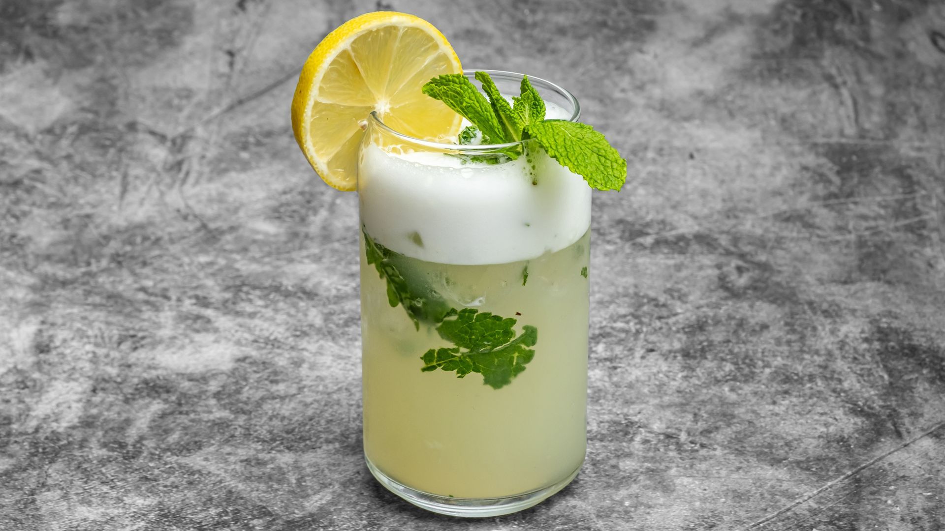 Lemonade with mint and lemon slice garnish.