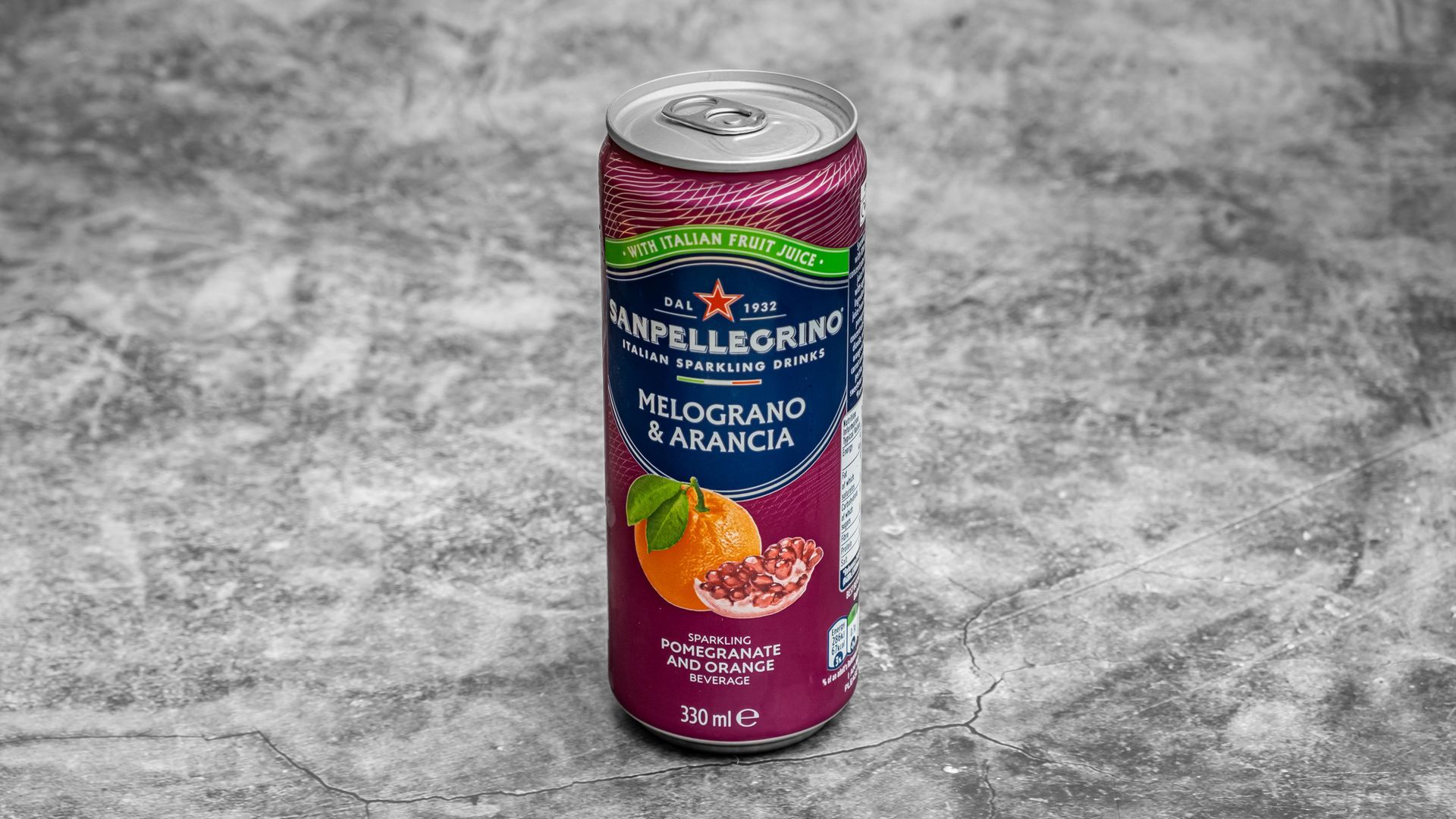 Sanpellegrino pomegranate and orange flavored sparkling drink can. Red, green, and blue label.