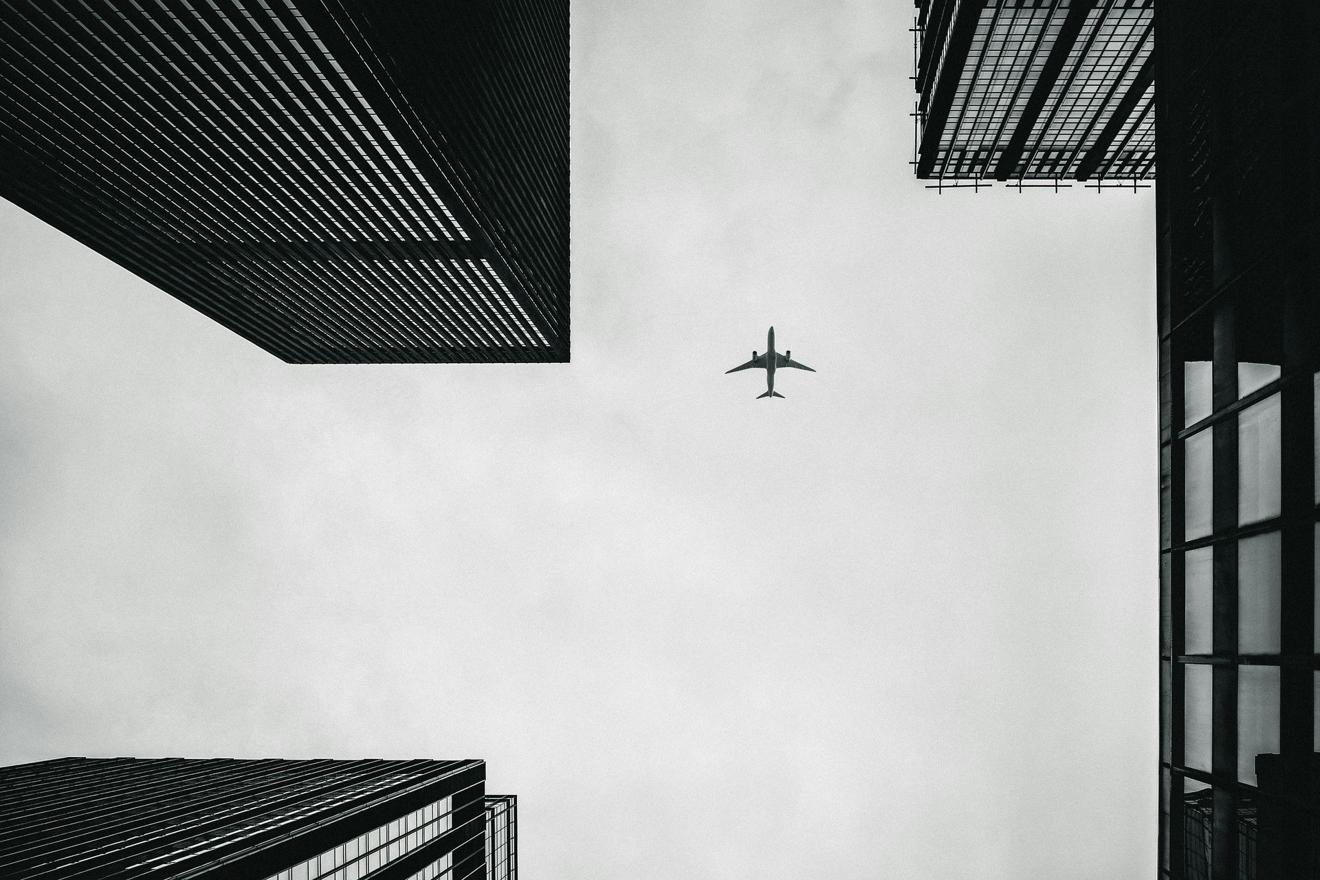 Airplane above skyscrapers