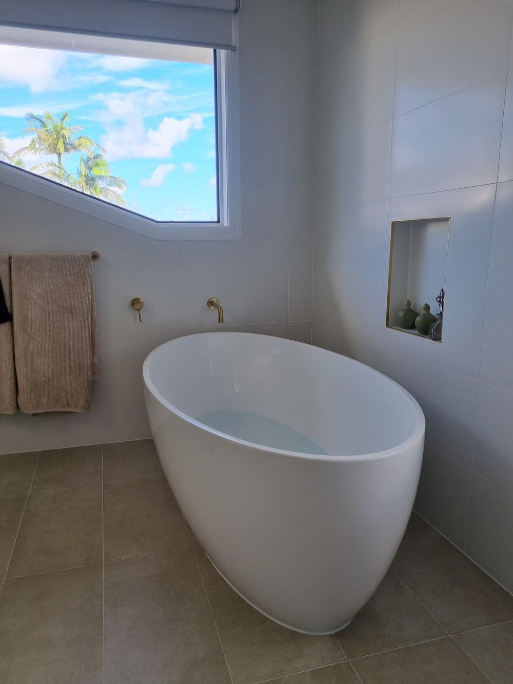 A Bathroom with A Bathtub and A Window — Origin Plumbing & Gas in Alstonville, NSW