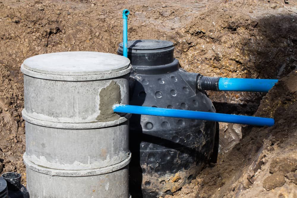 A Septic Tank Is Sitting in A Hole in The Ground — Origin Plumbing & Gas in Alstonville, NSW