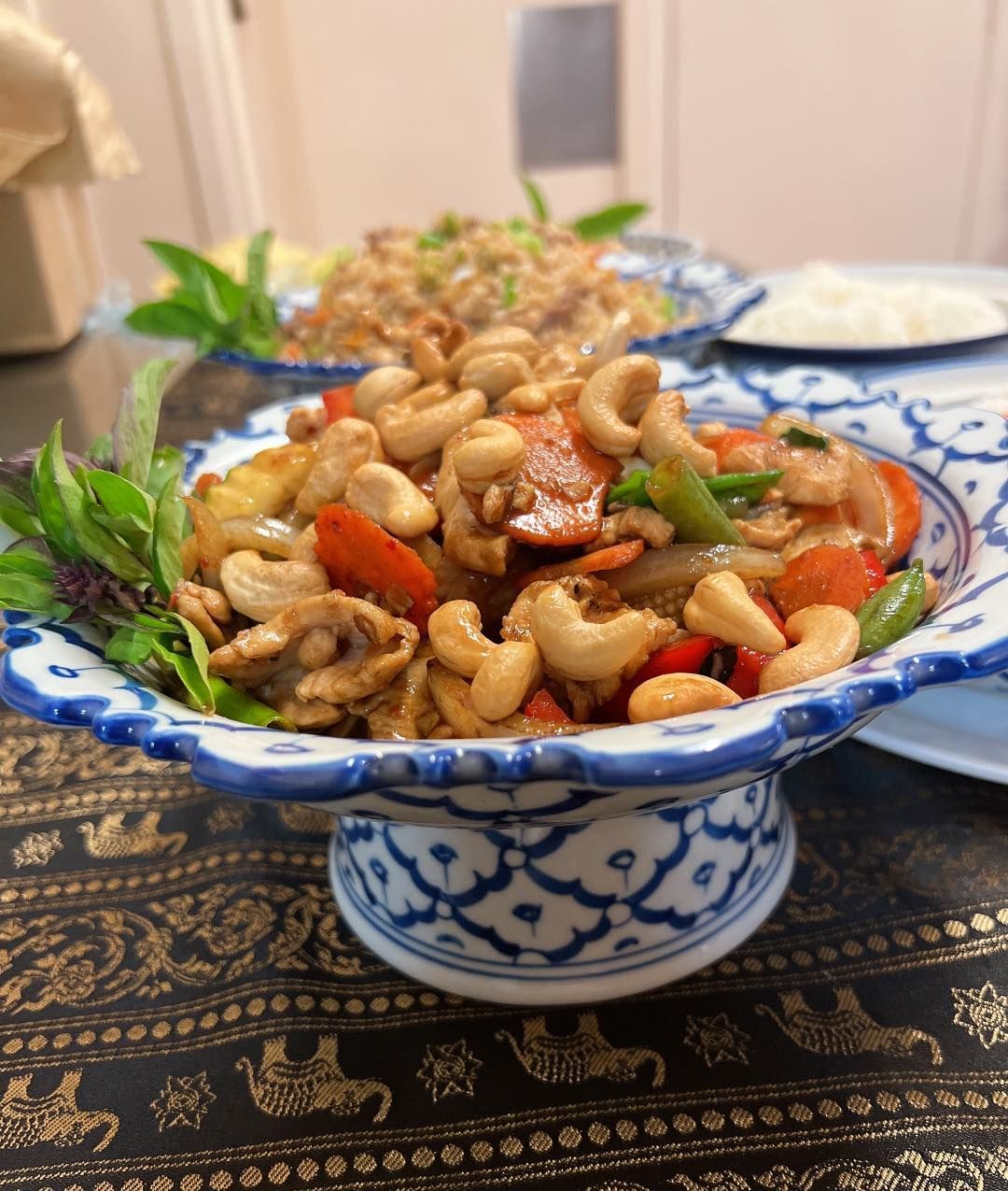 A Bowl of Food With Cashews and Vegetables on a Table — Thai Taste Restaurant In Yeppoon, QLD