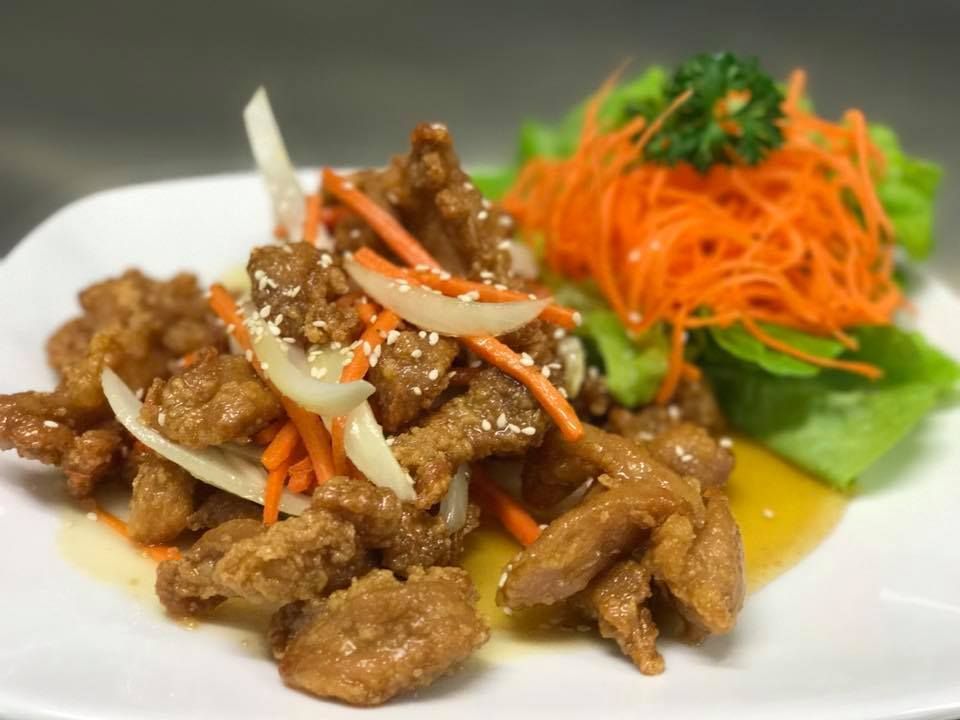 A Plate of Food With Meat, Carrots and Lettuce on a Table — Thai Taste Restaurant In Yeppoon, QLD