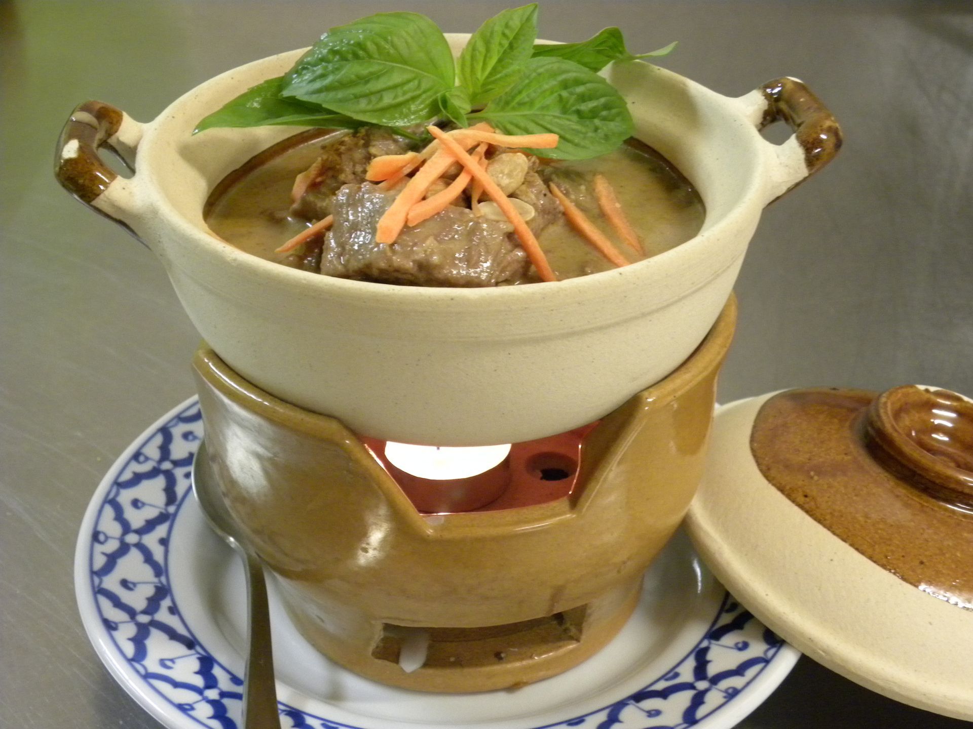 A Bowl of Soup With Carrots and Basil on Top — Thai Taste Restaurant In Norman Gardens, QLD