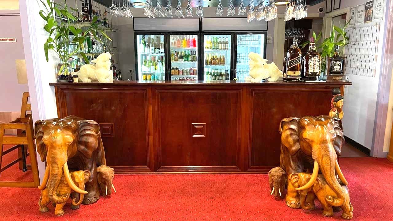A Large Dining Room With Tables and Chairs and a Red Carpet — Thai Taste Restaurant In Norman Gardens, QLD