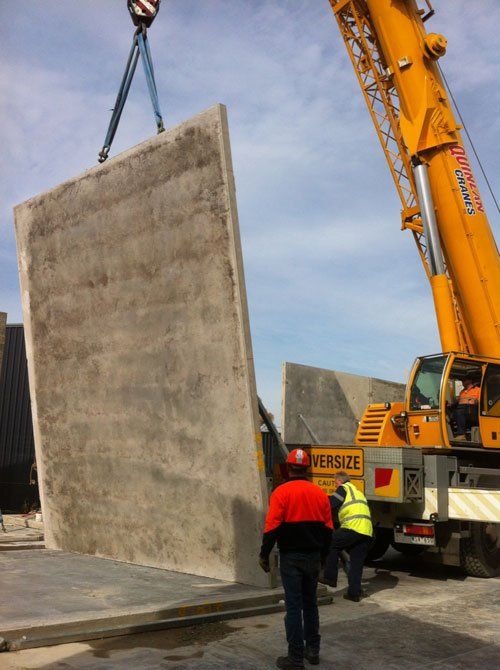 Machine being used to lift wall