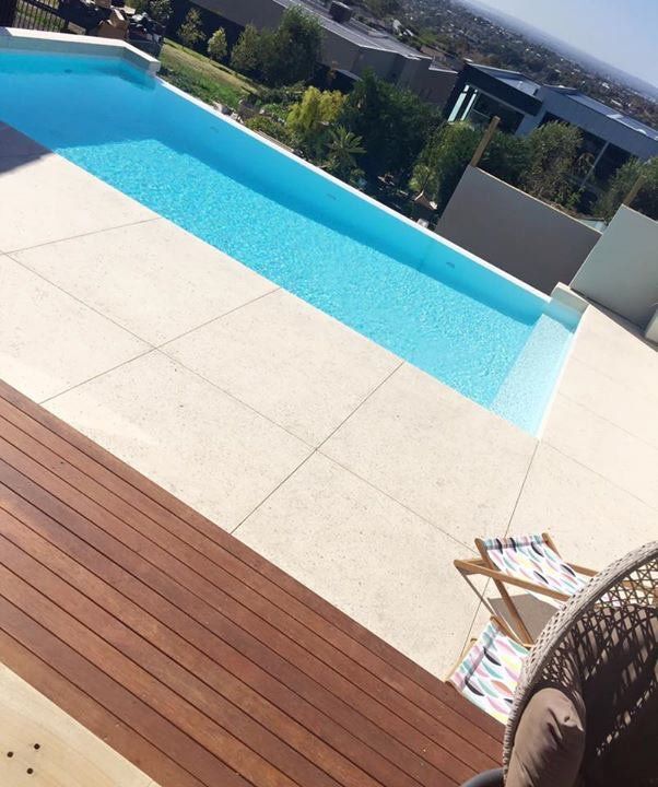 View of a pool with concrete surrounding