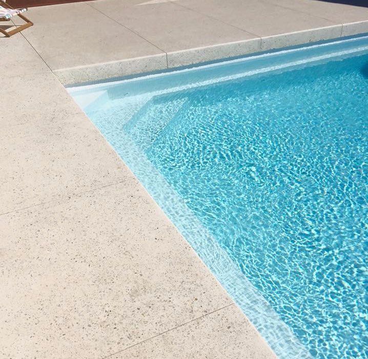 View of a pool with concrete surrounding